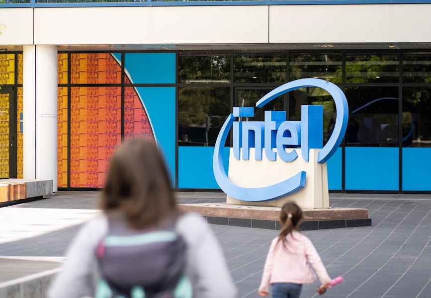 women in front of an office building