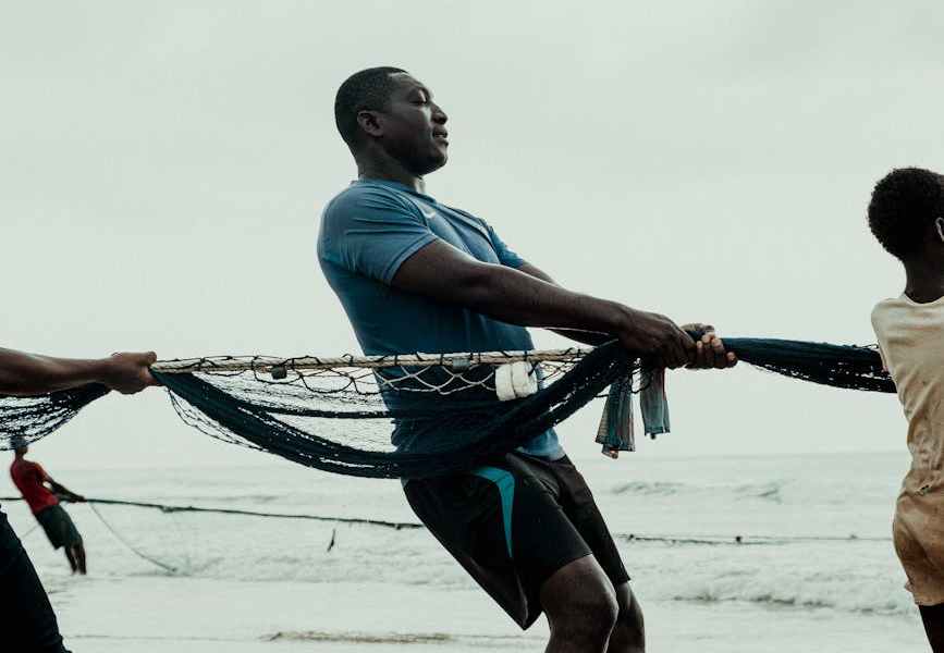 men holding a line on a street