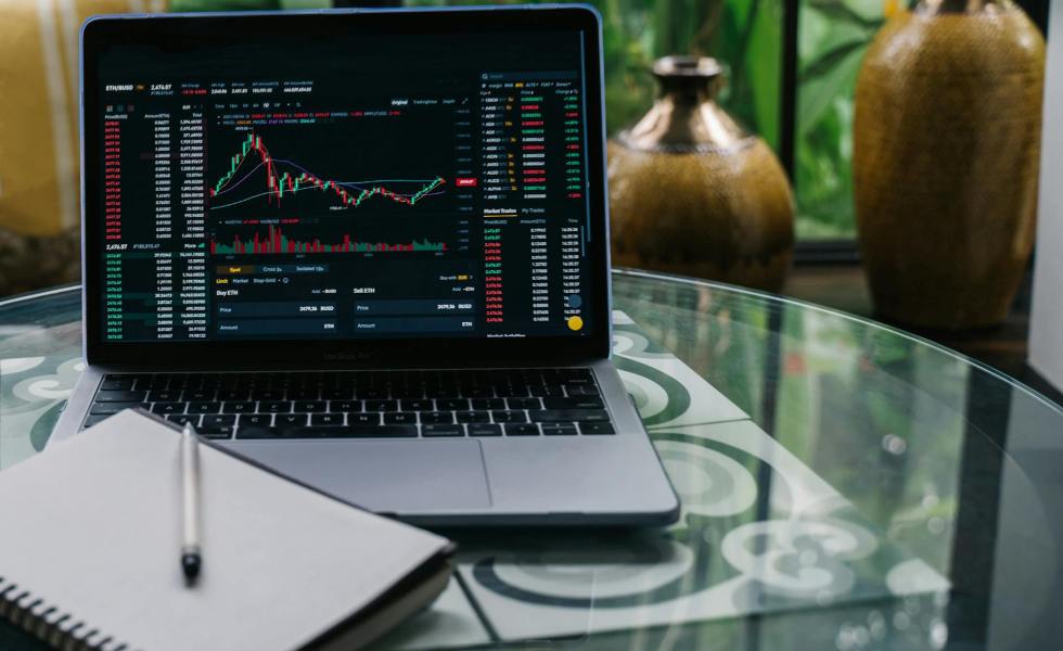 cryptocurrency chart displayed on a laptop