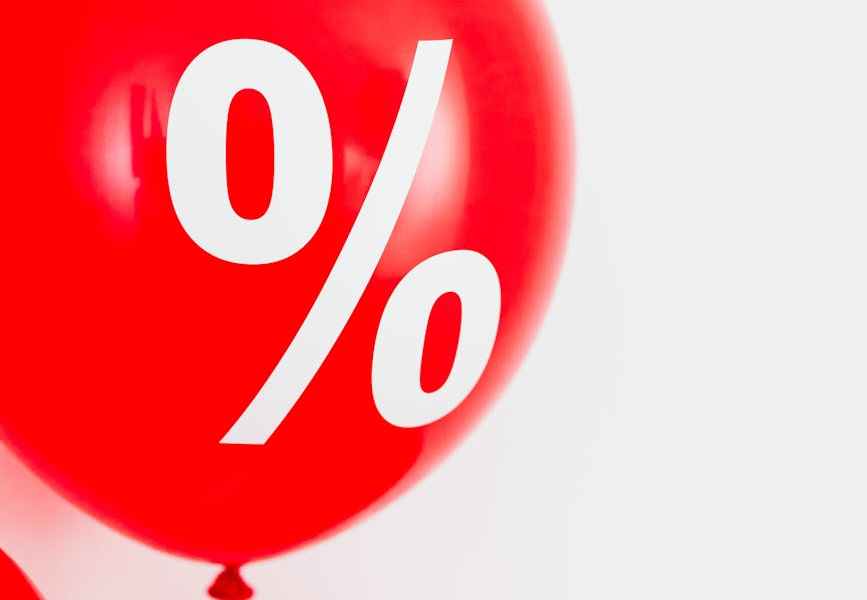 close up view of a red balloon with percentage symbol