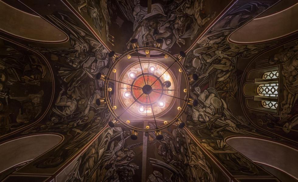 majestic ceiling of catholic cathedral with round shaped lamp