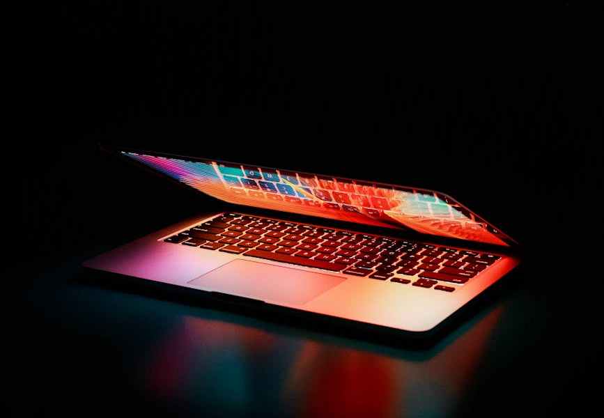 semi opened laptop computer turned on on table