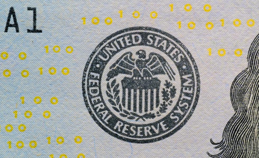 close up of us federal reserve symbol on currency