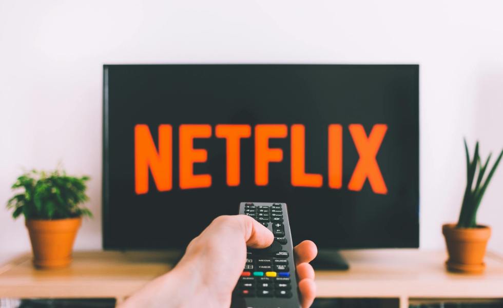 person holding a remote control
